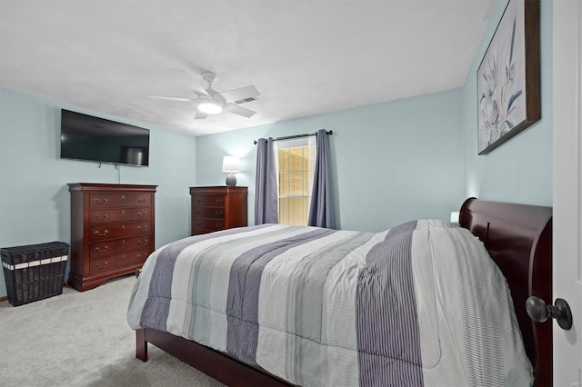 bedroom with a ceiling fan and carpet flooring