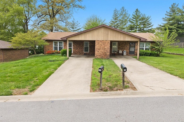 single story home with brick siding, a front lawn, and driveway