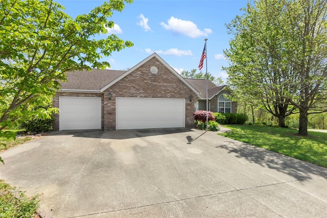 ranch-style home with a front yard, a garage, a shingled roof, driveway, and brick siding