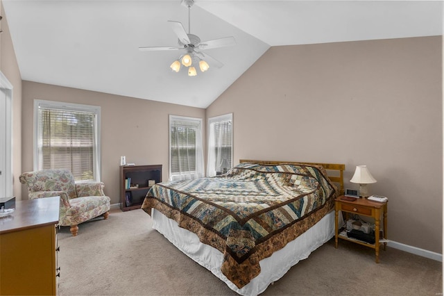 carpeted bedroom with a ceiling fan, high vaulted ceiling, and baseboards