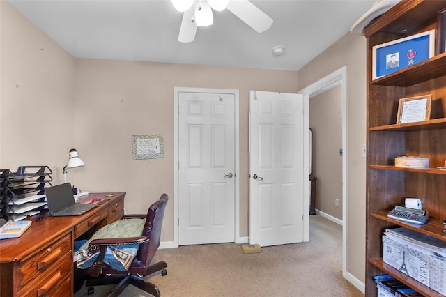 home office with ceiling fan, carpet flooring, and baseboards