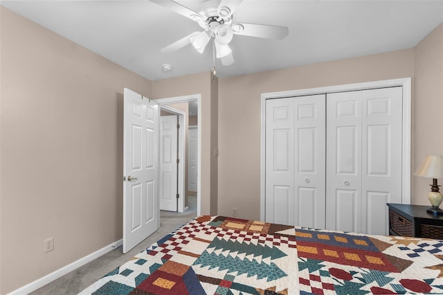 bedroom featuring a closet, ceiling fan, carpet floors, and baseboards