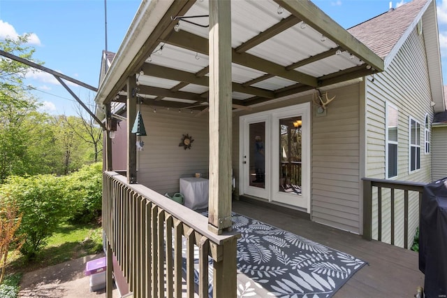 exterior space featuring roof with shingles