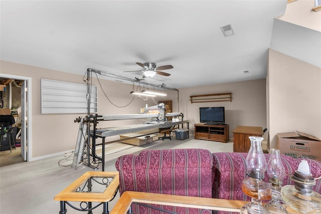 living area with baseboards, visible vents, a ceiling fan, and carpet flooring