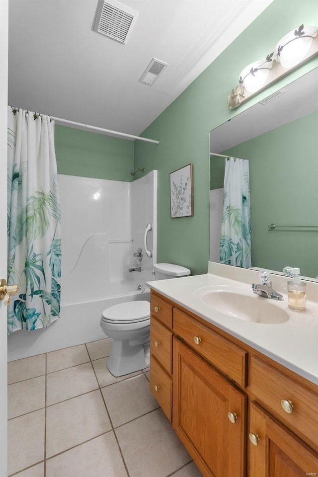bathroom with tile patterned floors, shower / tub combo, visible vents, and toilet