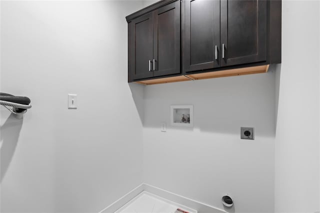 laundry area featuring washer hookup, hookup for an electric dryer, baseboards, and cabinet space