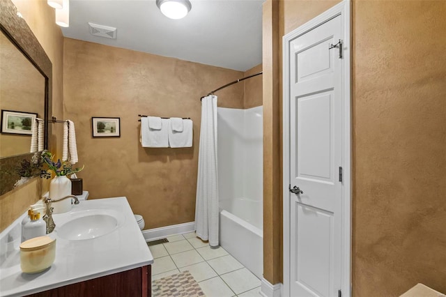 full bathroom featuring visible vents, tile patterned flooring, shower / tub combo, vanity, and baseboards