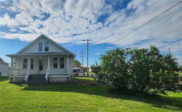 view of front of property with a front yard and covered porch