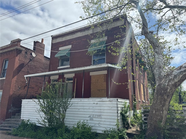 exterior space featuring brick siding