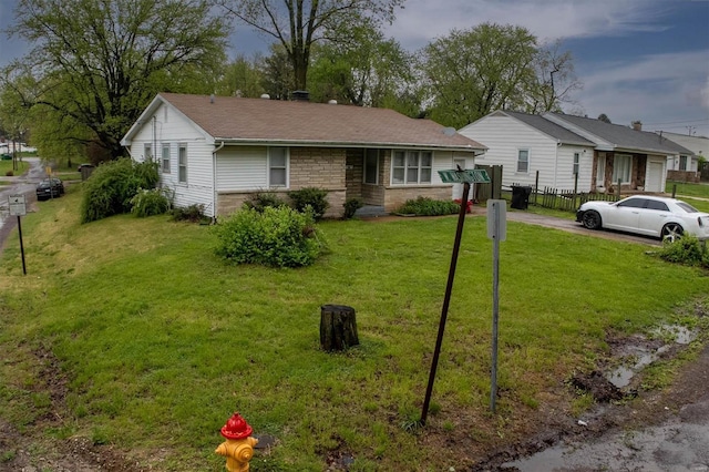 single story home with fence and a front yard