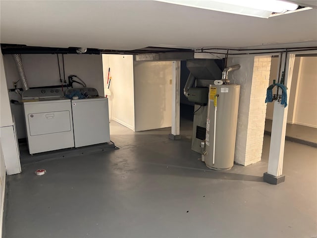 unfinished below grade area with washer and clothes dryer and gas water heater