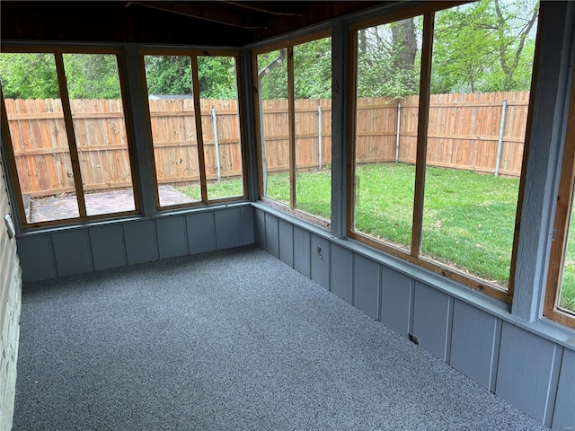 unfurnished sunroom featuring a wealth of natural light