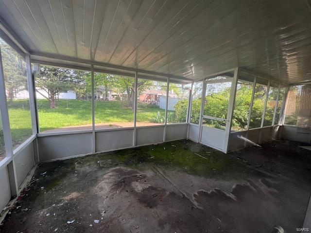 unfurnished sunroom with a wealth of natural light
