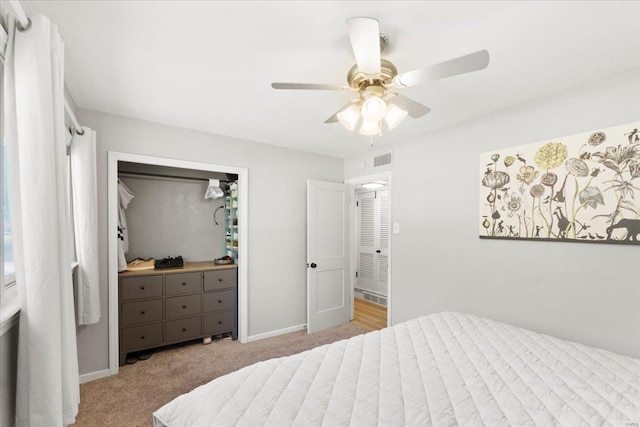 bedroom with ceiling fan, carpet floors, baseboards, visible vents, and a closet