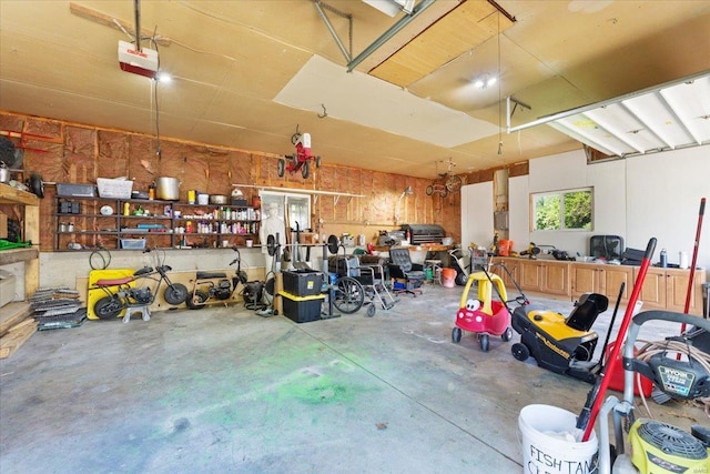 garage featuring a workshop area and a garage door opener