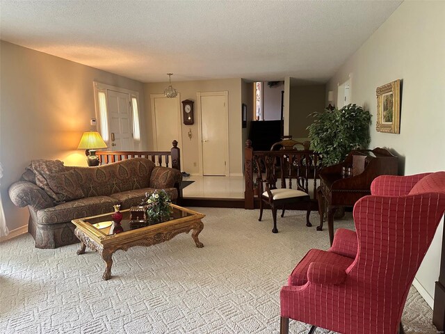 living room featuring baseboards and carpet flooring