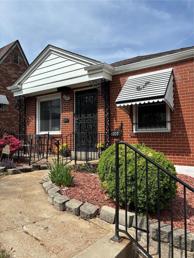 view of front of house featuring brick siding