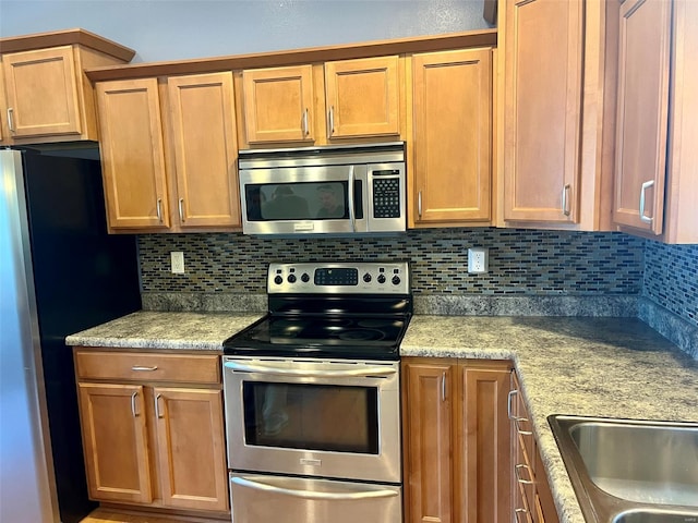 kitchen featuring backsplash and appliances with stainless steel finishes