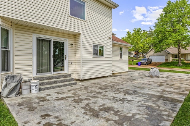 rear view of property featuring a patio area and entry steps