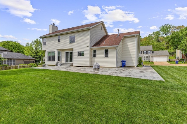 rear view of property featuring a lawn, a patio, a chimney, and entry steps