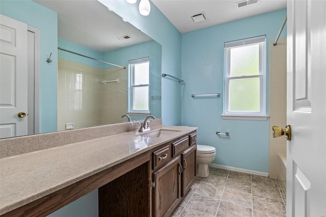 full bathroom featuring vanity, baseboards, toilet, and visible vents