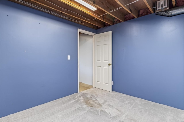 finished basement featuring carpet flooring