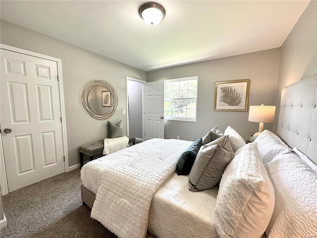 carpeted bedroom with baseboards