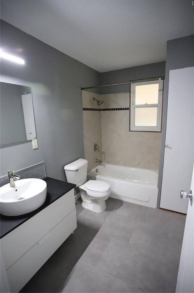 full bathroom with toilet, tile patterned flooring, vanity, and shower / bathing tub combination