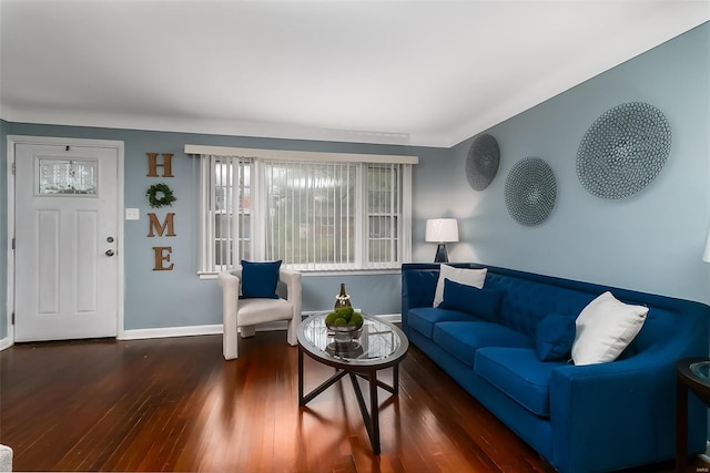 living room featuring baseboards and wood finished floors