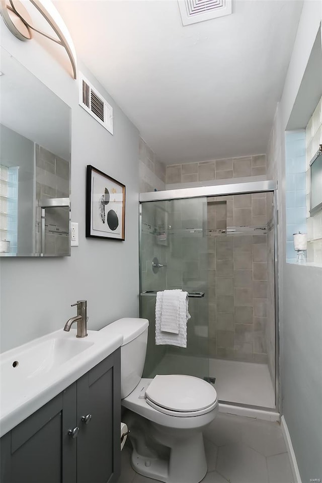 bathroom with toilet, tile patterned floors, visible vents, and a stall shower