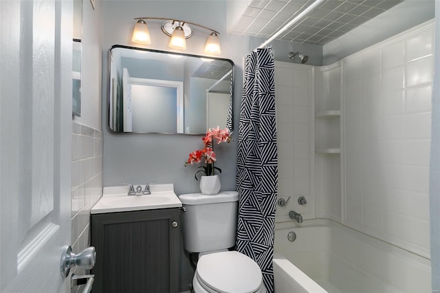 full bathroom with vanity, toilet, and shower / tub combo with curtain