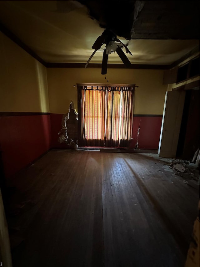 unfurnished room featuring ceiling fan and hardwood / wood-style flooring