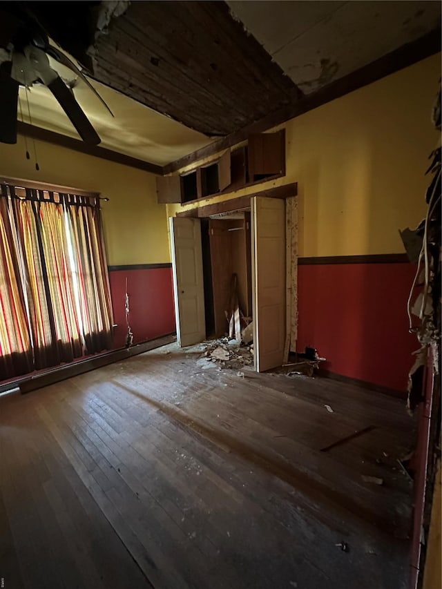 spare room with hardwood / wood-style floors and ceiling fan