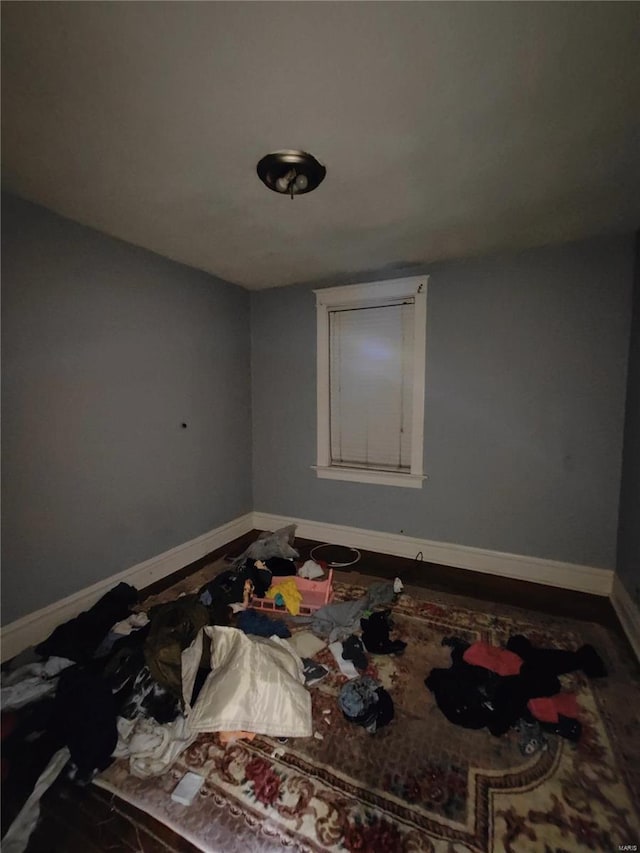 spare room featuring baseboards