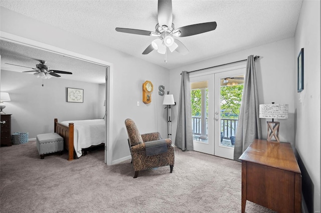 interior space with ceiling fan, carpet, french doors, and a textured ceiling