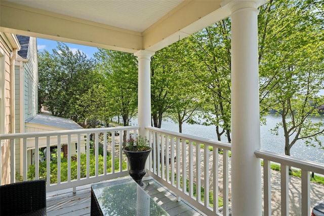 wooden terrace with a water view