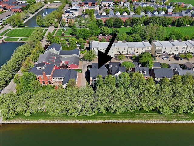 drone / aerial view with a residential view and a water view