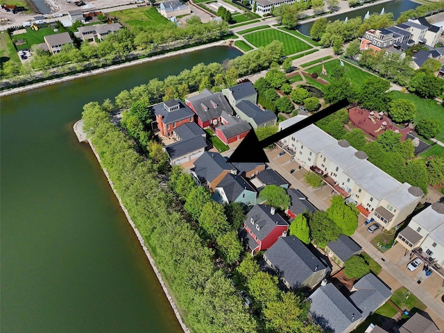 birds eye view of property with a water view and a residential view