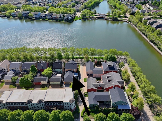 drone / aerial view featuring a residential view and a water view