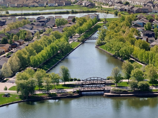 birds eye view of property featuring a water view and a residential view