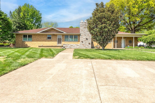 single story home with a front lawn, brick siding, and a chimney