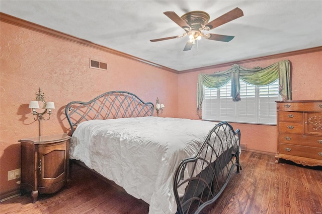 bedroom featuring crown molding, a textured wall, visible vents, and wood finished floors