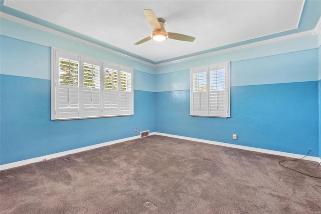 spare room featuring a wealth of natural light, ceiling fan, and crown molding