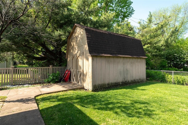 view of shed with fence