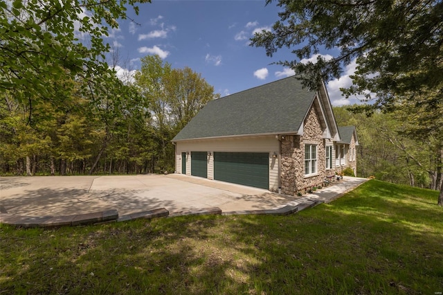 garage featuring concrete driveway