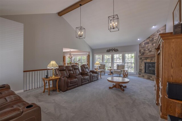 living room with a notable chandelier, high vaulted ceiling, carpet, and a fireplace