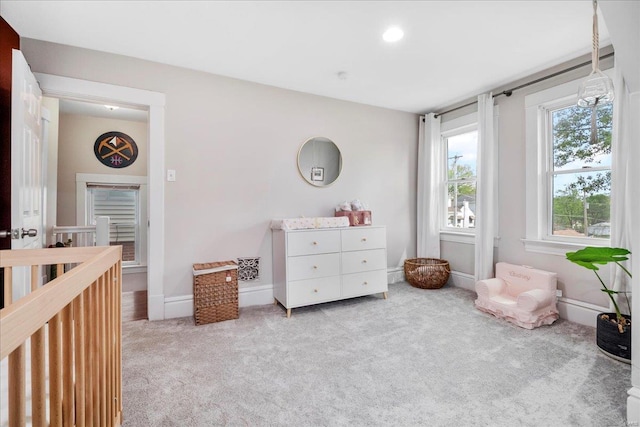 bedroom with baseboards and carpet flooring
