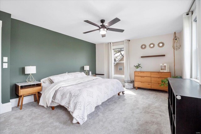 carpeted bedroom with ceiling fan