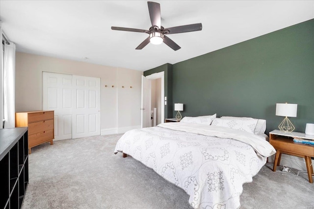 bedroom featuring a ceiling fan and light carpet