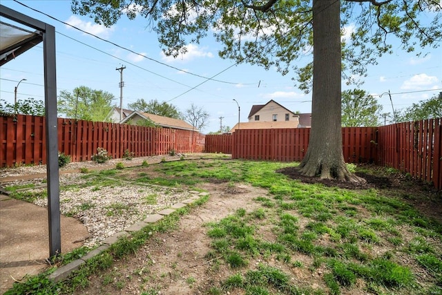 view of yard with a fenced backyard